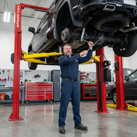 Two Post Car Lift Engineered for Professional Service, 12,000 lb Capacity, 167 Inch Height, Dual Hydraulic — Lifestyle